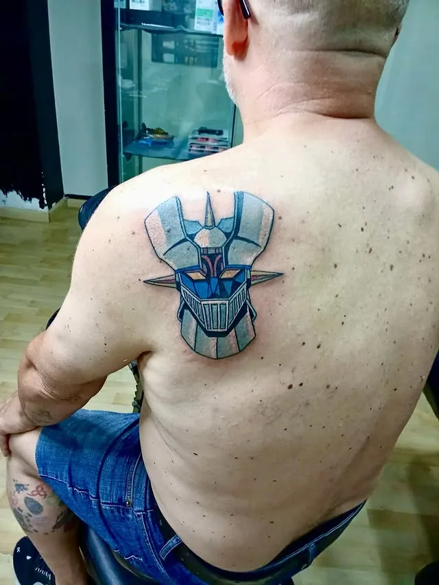 Máscara azul — Color, Espalda